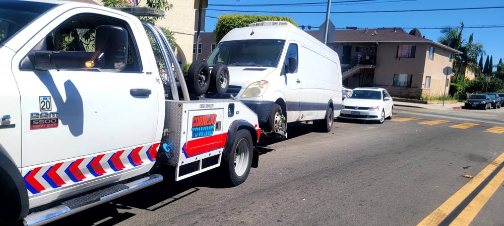 Los Angeles Towing truck loading a van